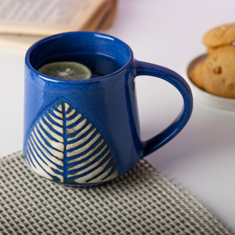 Thumbnail preview #2 for Blue Ceramic Coffee Mug with White Leaf Design