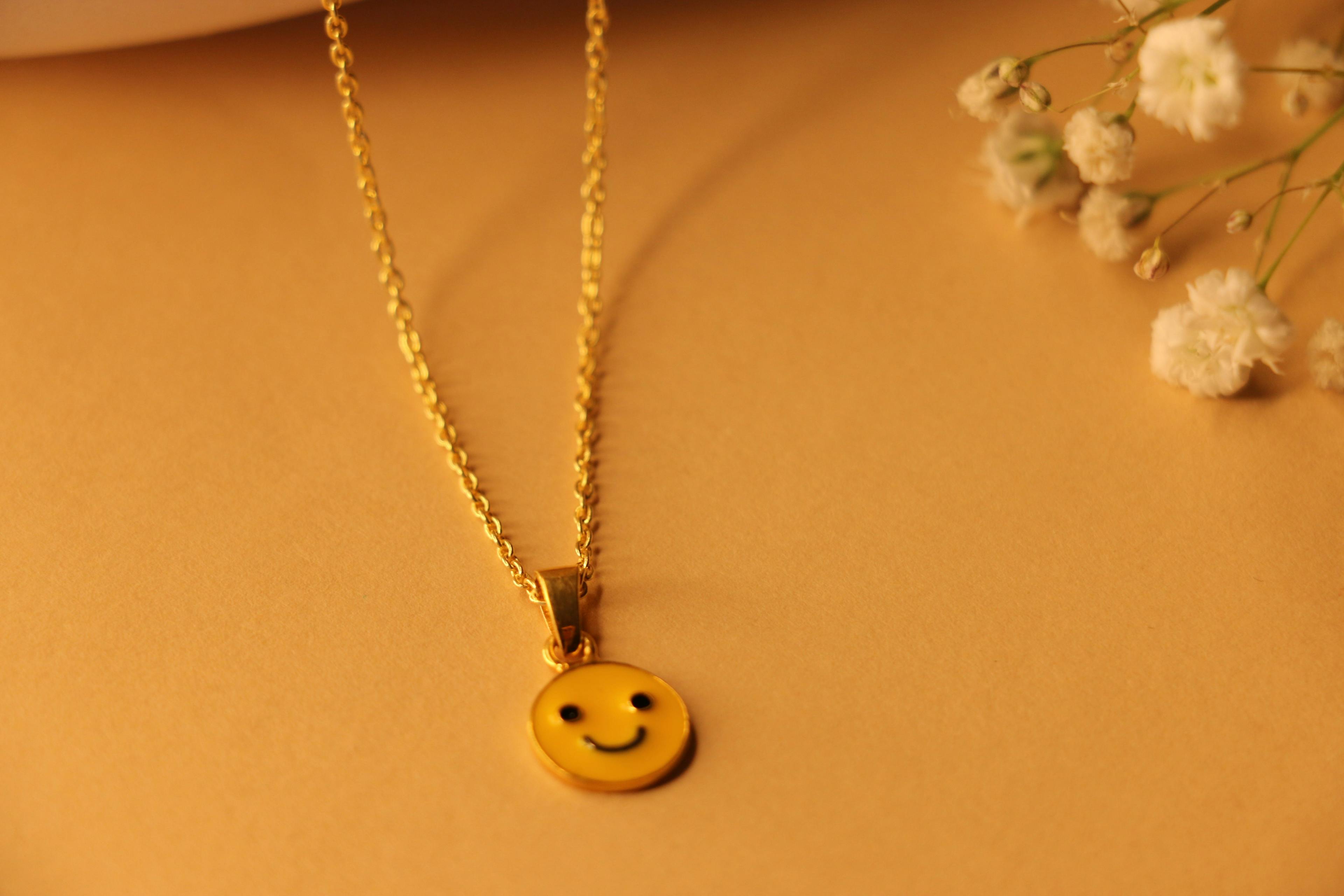 Smiley charm necklace, a product by The Jewel Closet Store