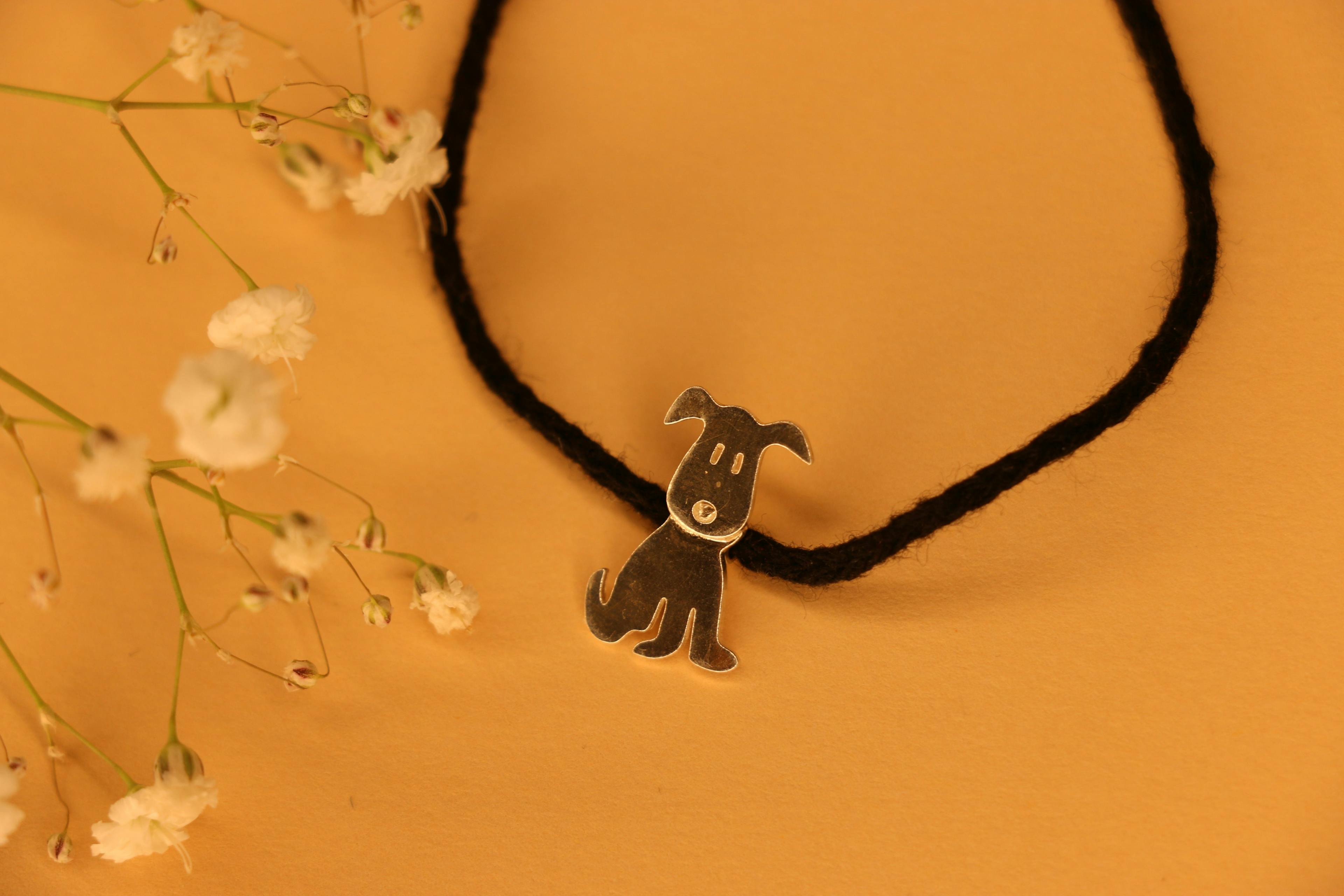 Dog shaped kids black thread nazarbattu, a product by The Jewel Closet Store