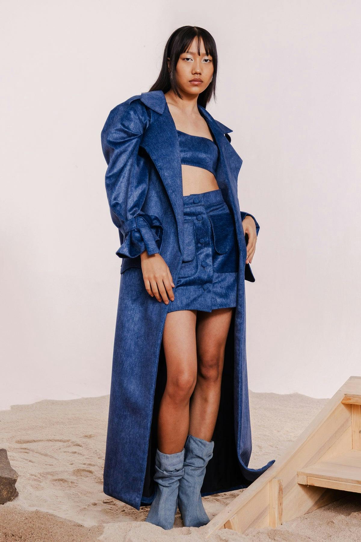 TAVI INDIGO TRENCH COAT WITH MATCHING BANDEAU & MINI SKIRT, a product by July Issue