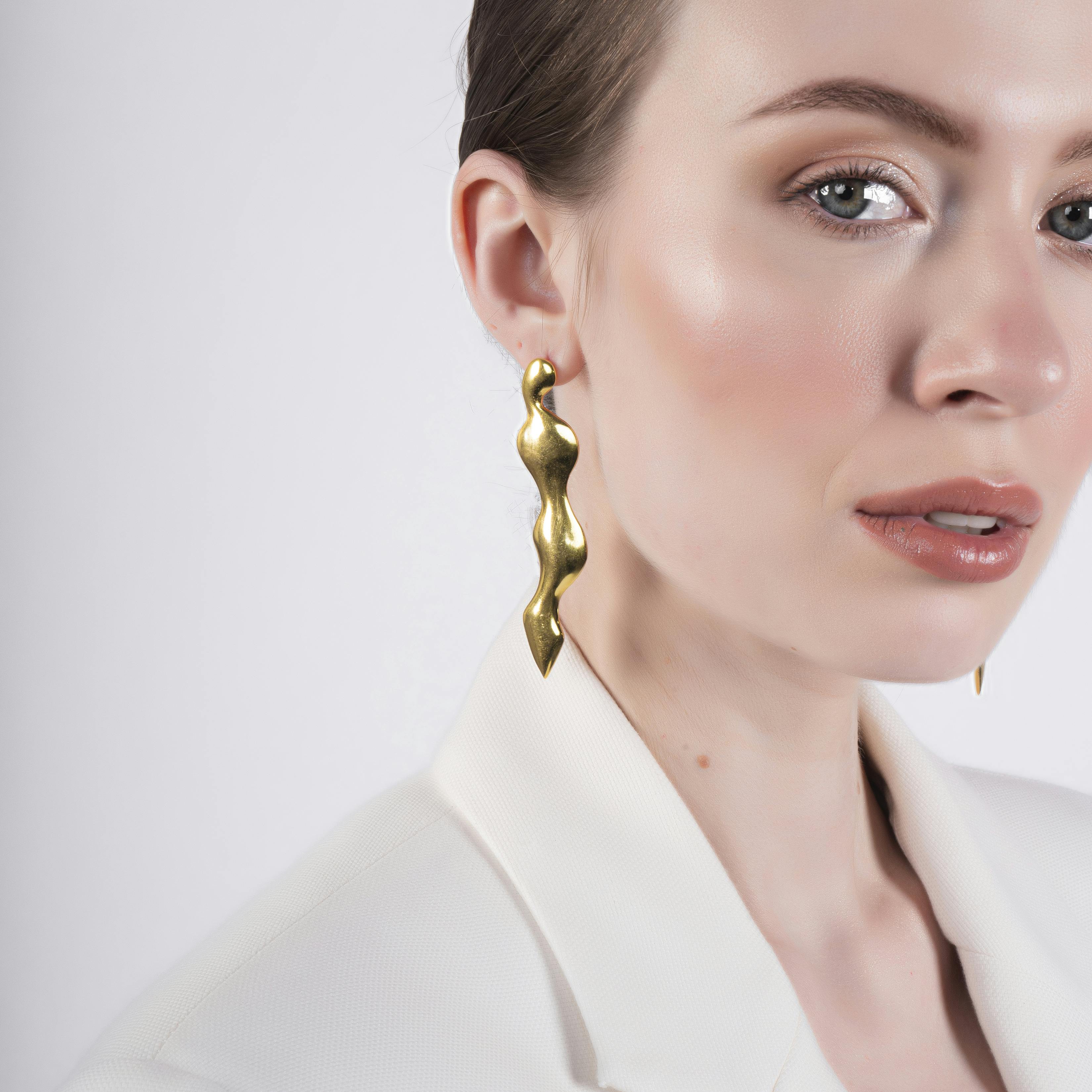 WATER STREAM EARRINGS - GOLD TONE, a product by Equiivalence